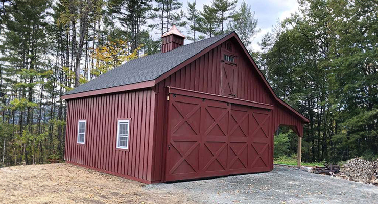 red garage with lean-to