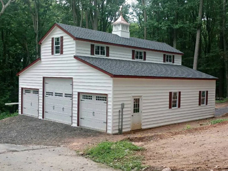 Barn style garage with red trim