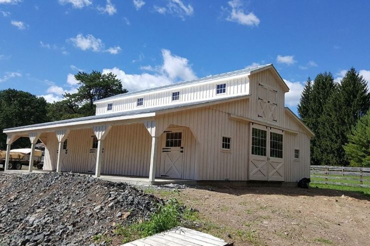 White large horse barn with center aisle