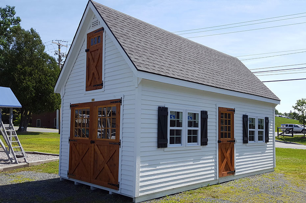 Rustic farmhouse garage with white siding