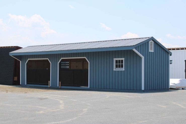 blue loafing shed with tack room