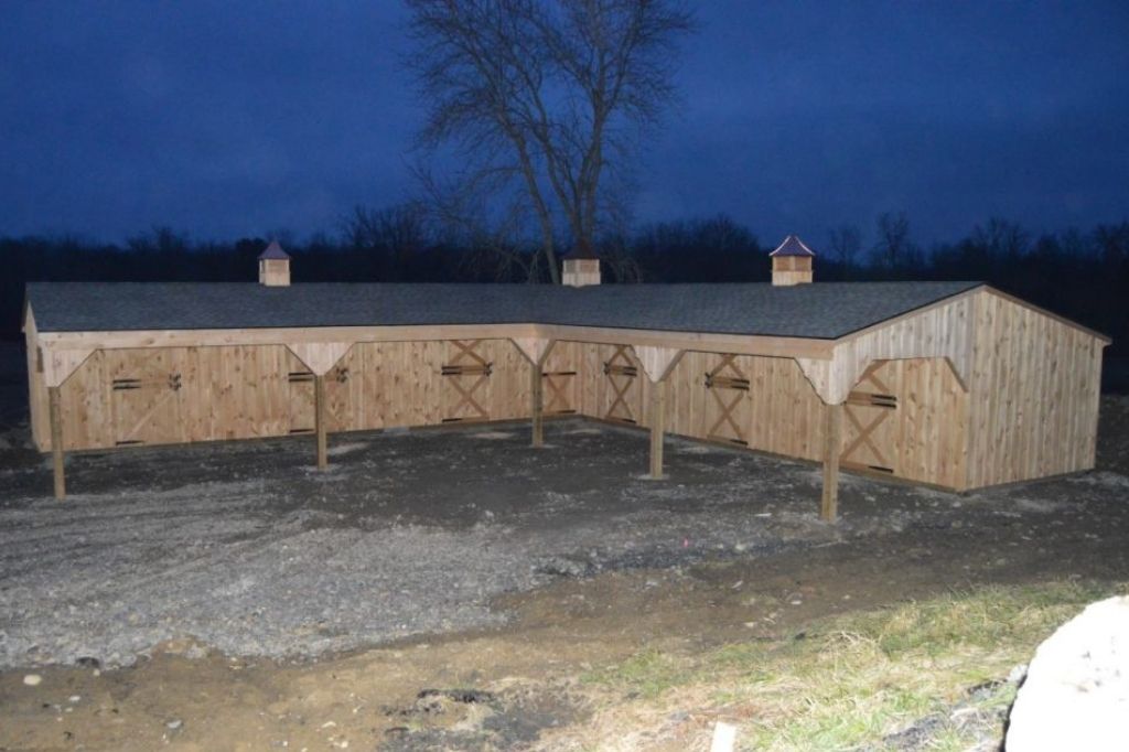 large l shaped barn designed on ranch