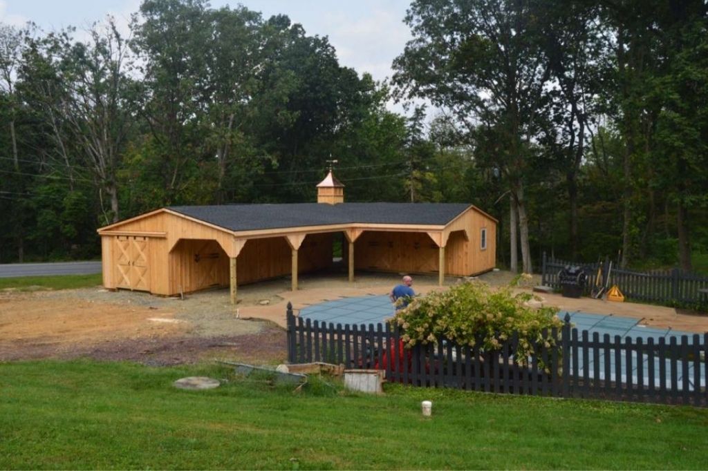 L shaped barn by pool