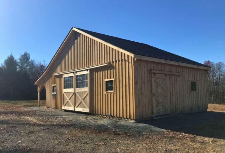 kennebec horse barn style with lean to and large double wooden doors