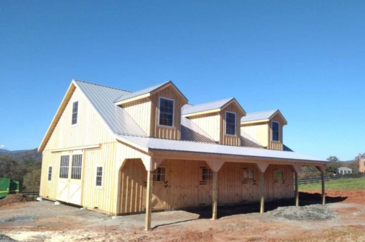 natural stained horse barn with board and batten siding