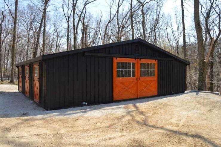 black barn with stained doors