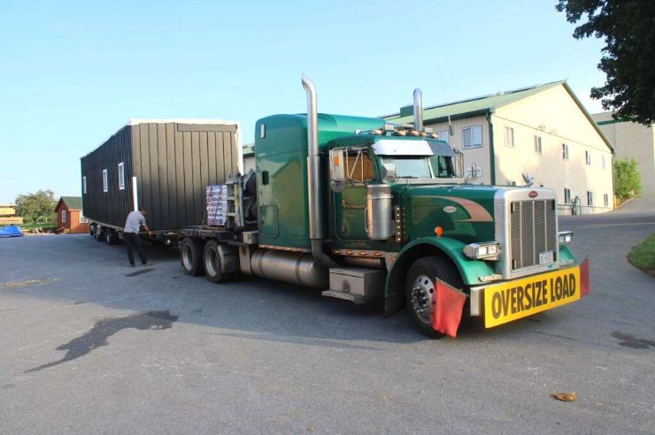 black barn being transported