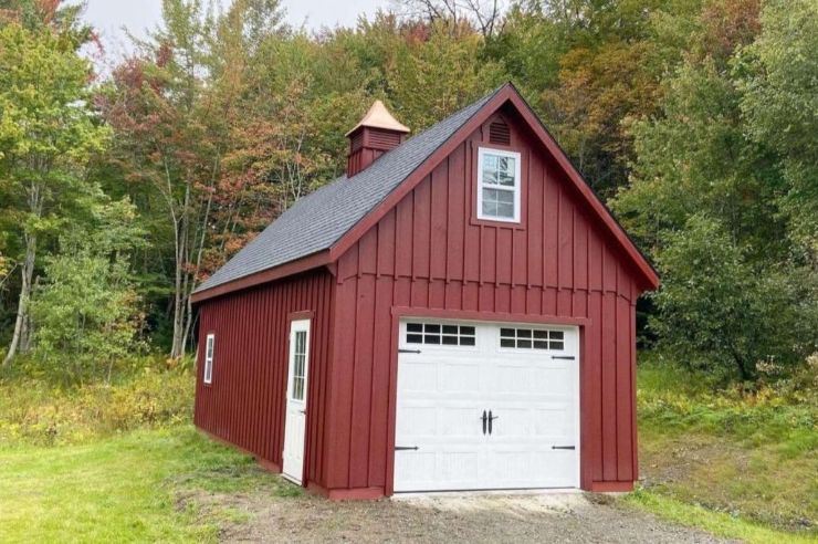 detached storage garage shed with red siding