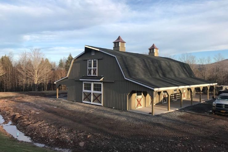 A large barn with asphalt barn roof materials