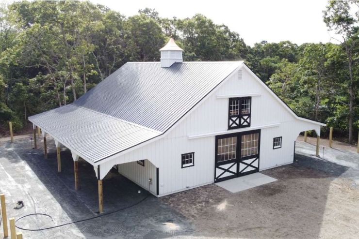 metal roof on two story barn with two lean-tos