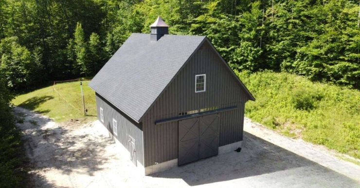 charcoal backyard workshop double wide garage surrounded by trees