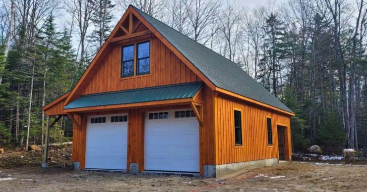 wood stained backyard workshop garage barn with overhang