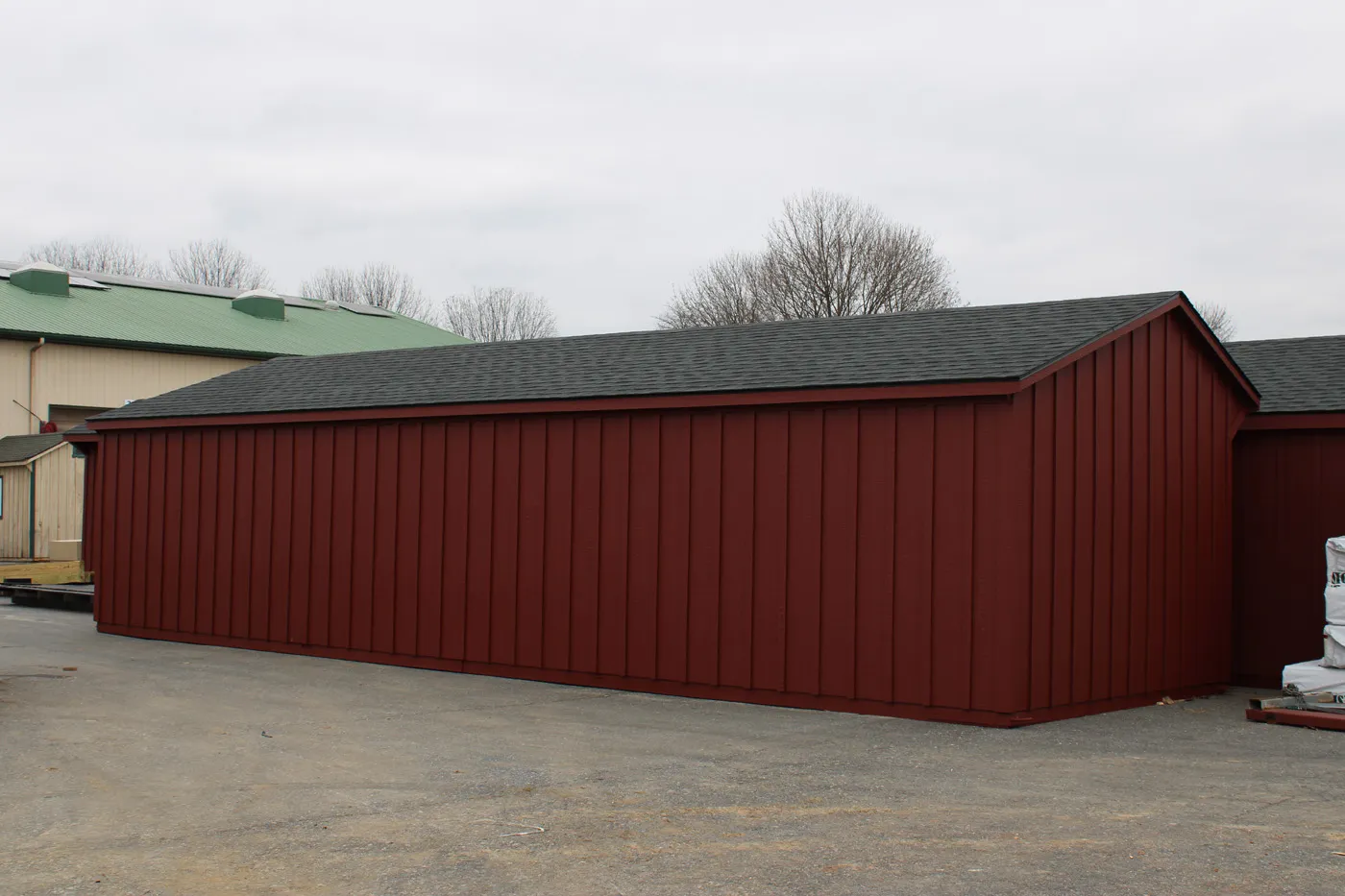 red run-in shed with charcoal shingles