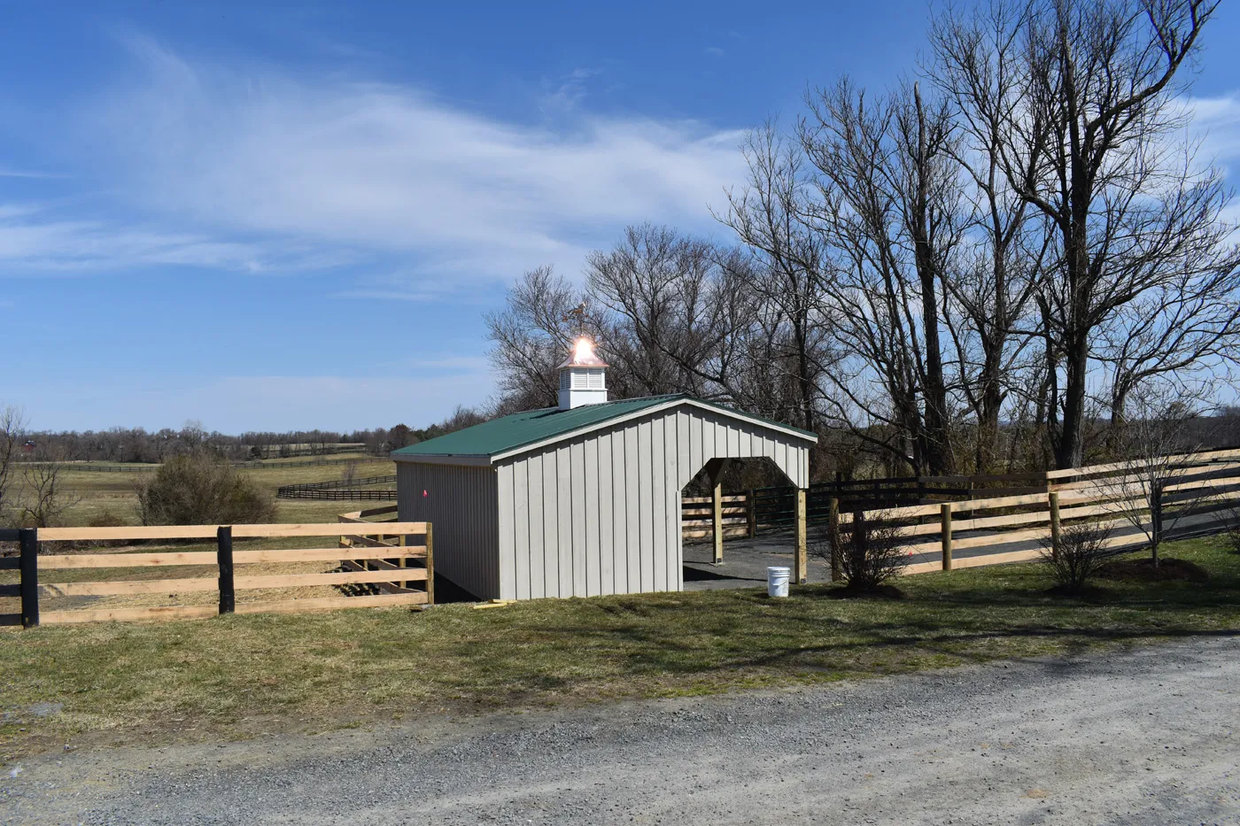 run-in shed with lean-to and green metal roof