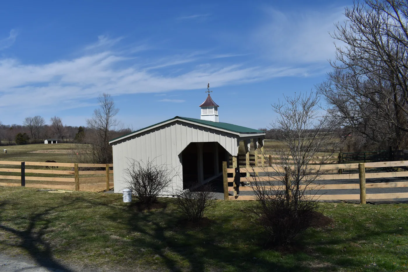 run-in shed with lean-to and green metal roof
