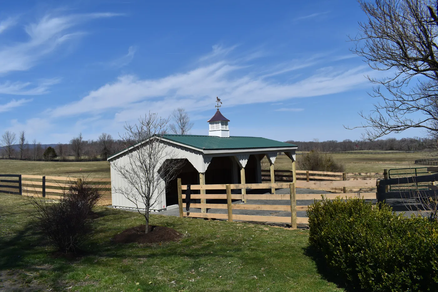 run-in shed with lean-to and green metal roof